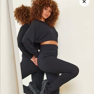 Black two piece rip crop top and leggings set.